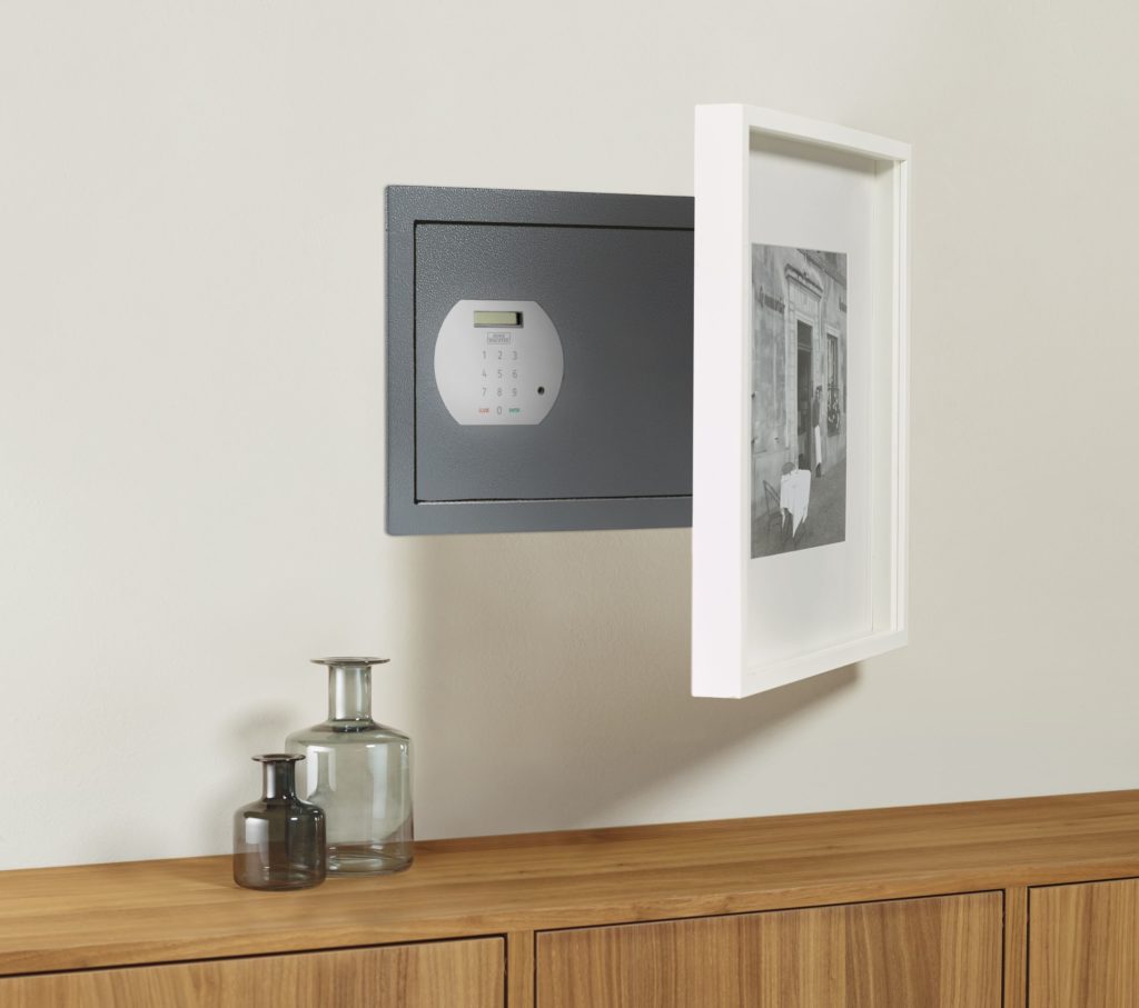 Discreet wall safe hidden behind artwork for luxury home security